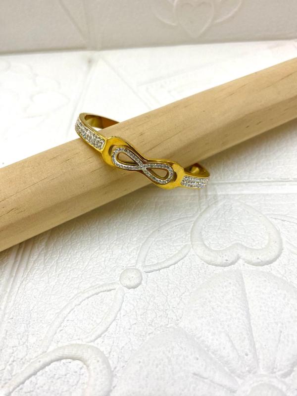 PULSERA DE ACERO RIGIDA TIFFANNY DISE&Ntilde;O LAZO PERLAS DORADO