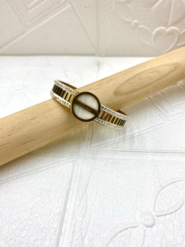 PULSERA DE ACERO RIGIDA CARTIER DISE&Ntilde;O CIRCULO CON PERLAS DORADO