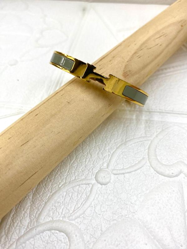PULSERA DE ACERO RIGIDA HERMES DORADA DISE&Ntilde;O H GRIS