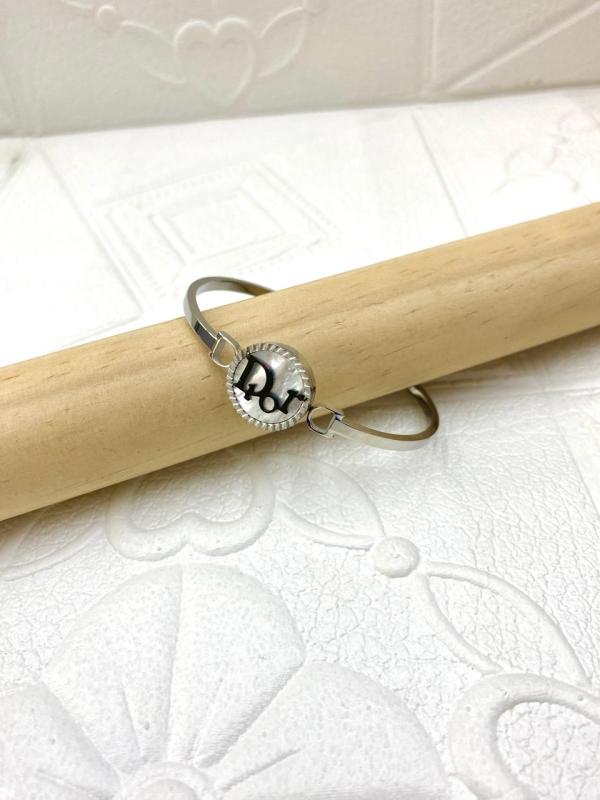 PULSERA DE ACERO RIGIDA DIOR PLATEADO