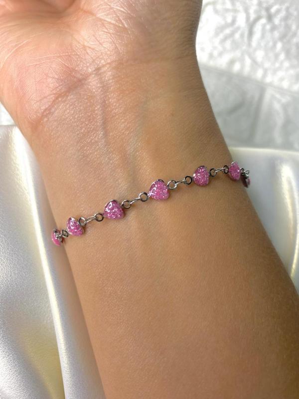 PULSERA DE ACERO PLATEADA CORAZONES ROSADOS