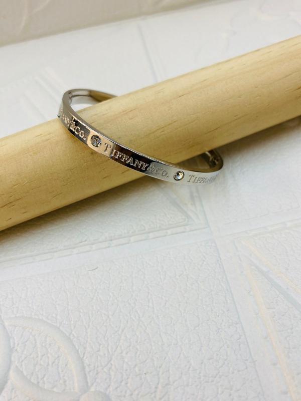 PULSERA DE ACERO RIGIDA TIFFANY & CO DISE&Ntilde;O PIEDRAS PLATEADO
